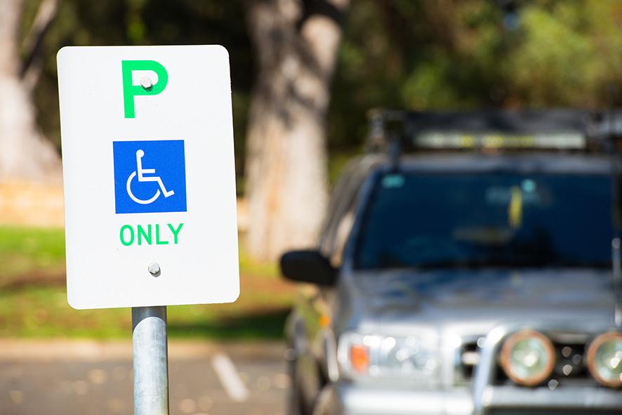 Accessible parking sign